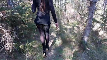 Walking On The Wood Wearing A Black Dress Pantyhose And High Heels Ankle Boots
